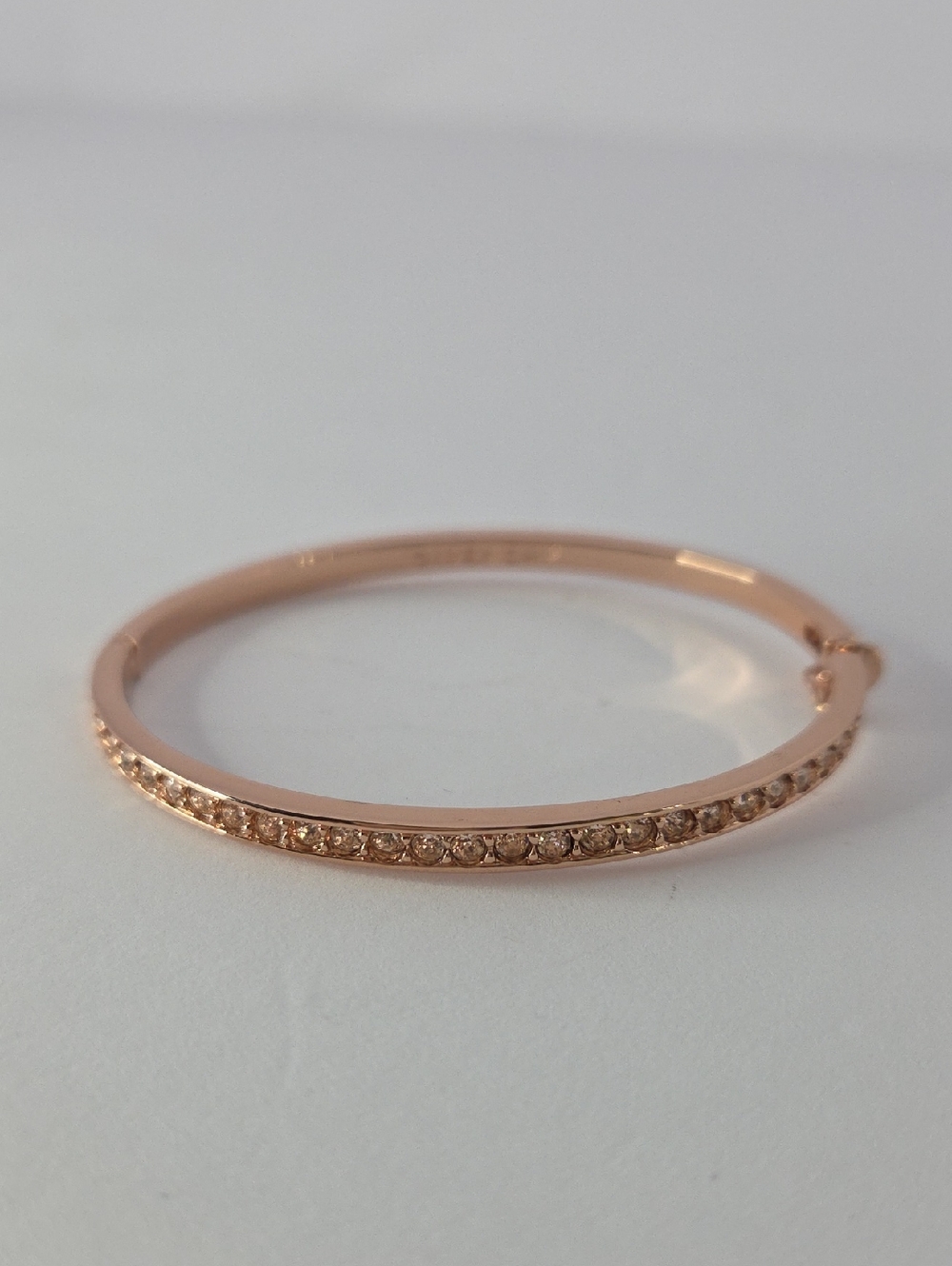 Givenchy Silk Crystal Element bangle bracelet in rose gold tone. 2.5" Diameter